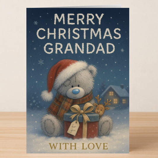Twisted Gifts Grandad Bear Christmas Card: charming design with a teddy bear in a Santa hat holding a gift, "Merry Christmas Grandad" and "With Love" text on snowy background—perfect for celebrating your grandad this Christmas.