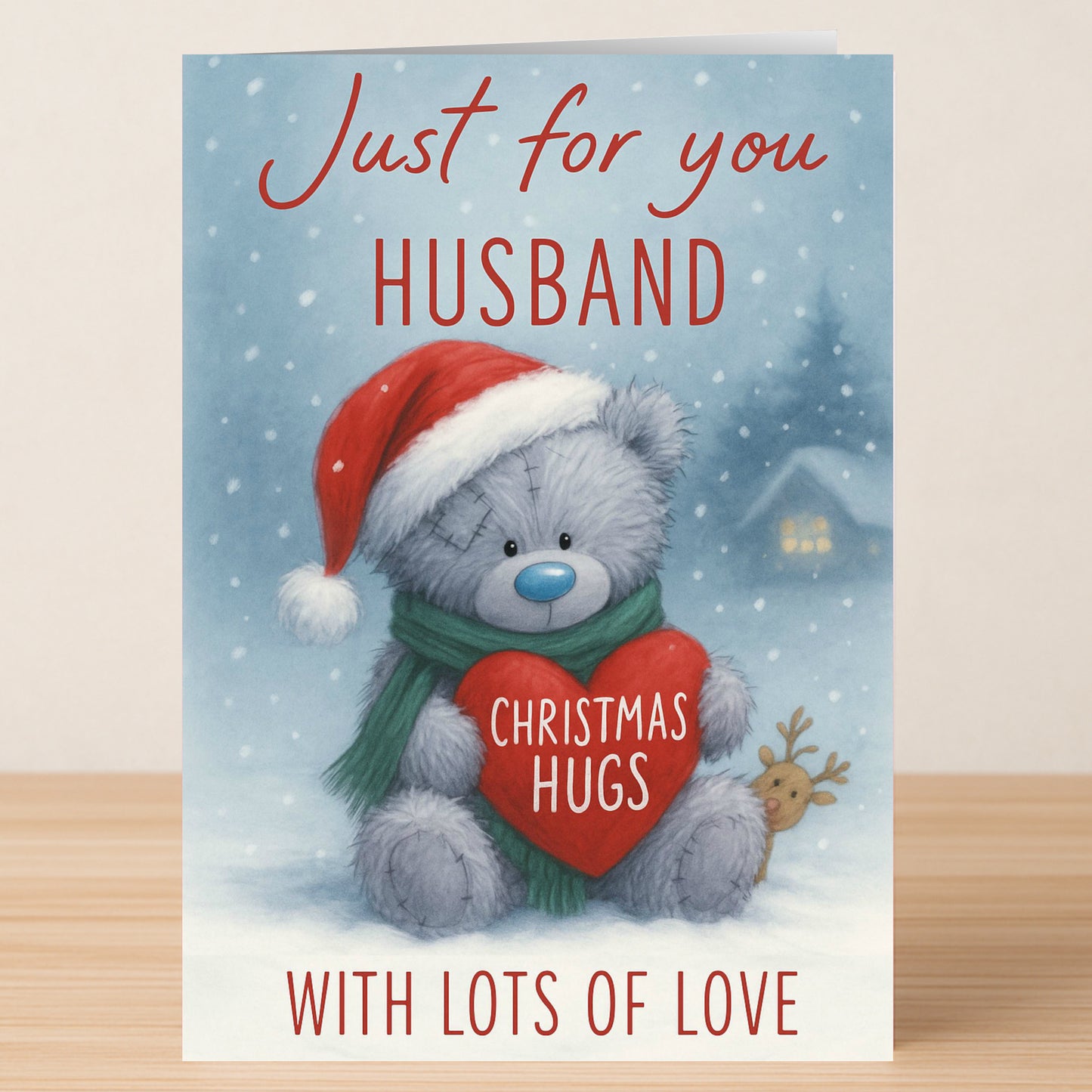 The Twisted Gifts Husband Bear Christmas Card features a gray teddy bear in a Santa hat and green scarf, holding a heart labeled "Christmas Hugs," with the message: "Just for you Husband, with lots of love.