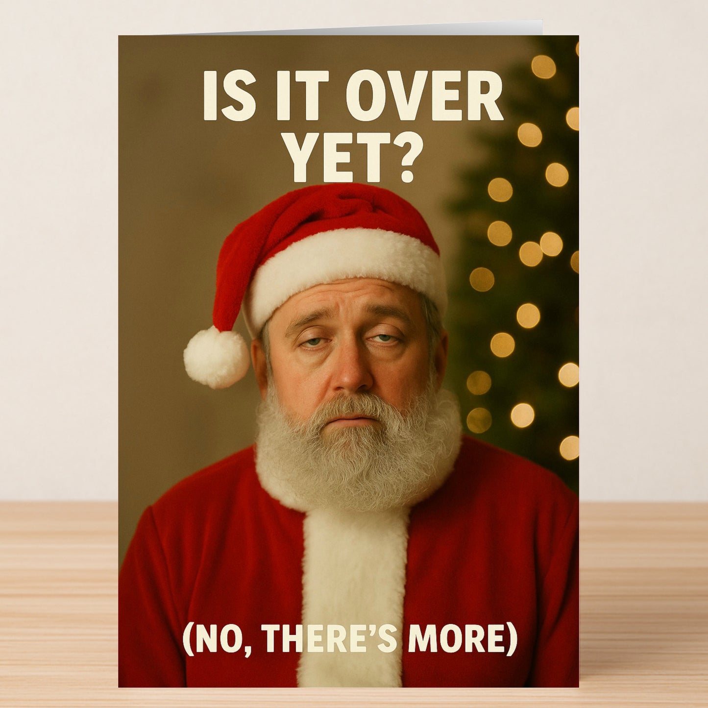 The Is It Over Christmas Card by Twisted Gifts features a tired Santa in front of a blurred Christmas tree with the text "Is it over yet? (No, there's more)"—a hilarious choice for anyone who loves dark holiday humor.