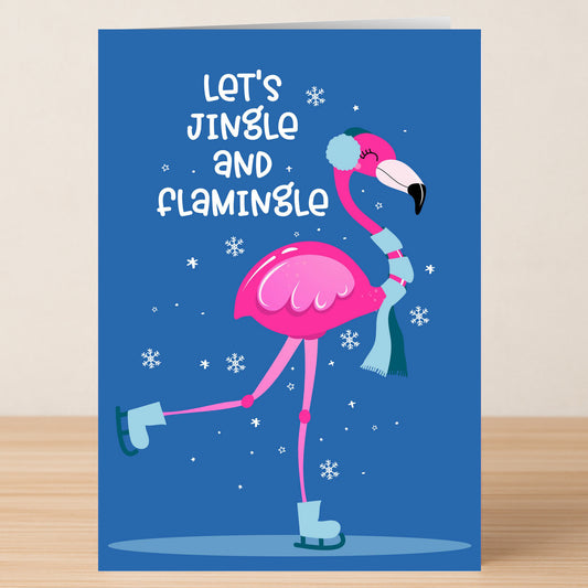Send Christmas cheer with the Jingle Christmas Card from Twisted Gifts—a funny holiday card featuring a pink flamingo in winter gear ice skating, with "Let's Jingle and Flamingle" on a snowy blue background.