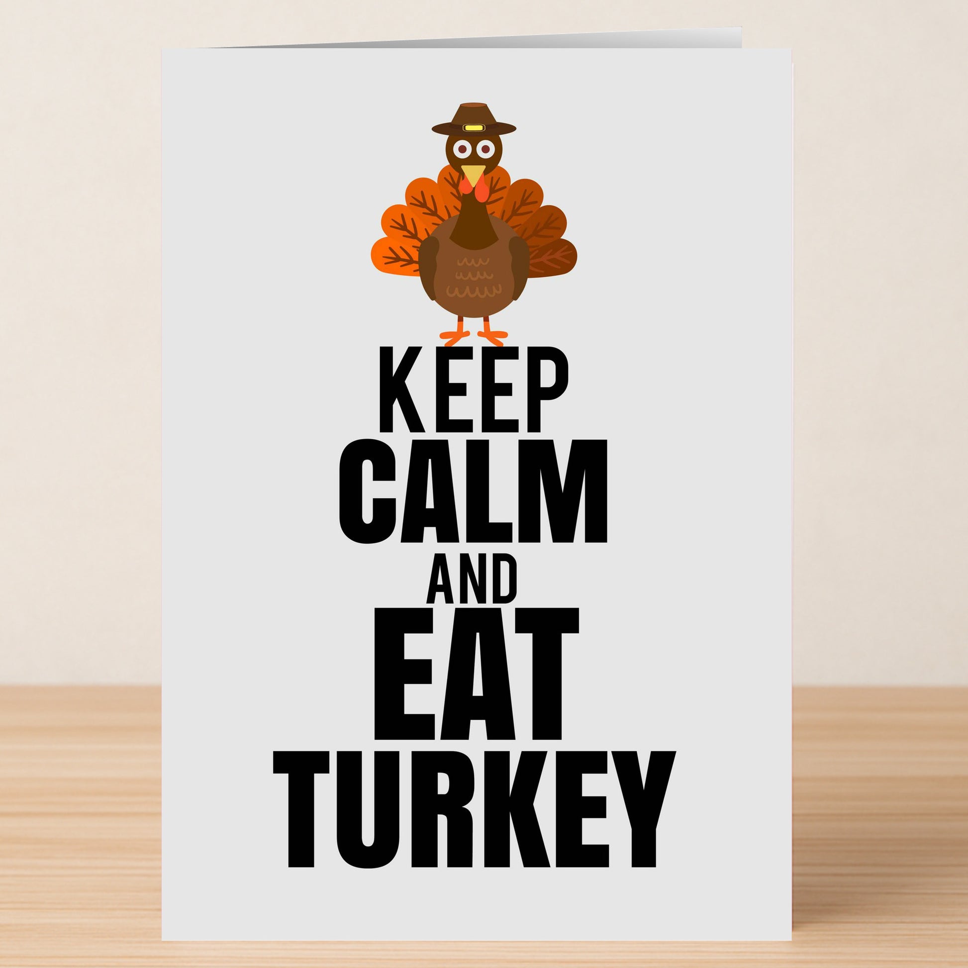 Spread festive cheer with the Twisted Gifts Keep Calm Christmas Card—featuring a cartoon turkey with colorful feathers and a hat above bold "KEEP CALM AND EAT TURKEY" text, it's the perfect funny holiday greeting!.