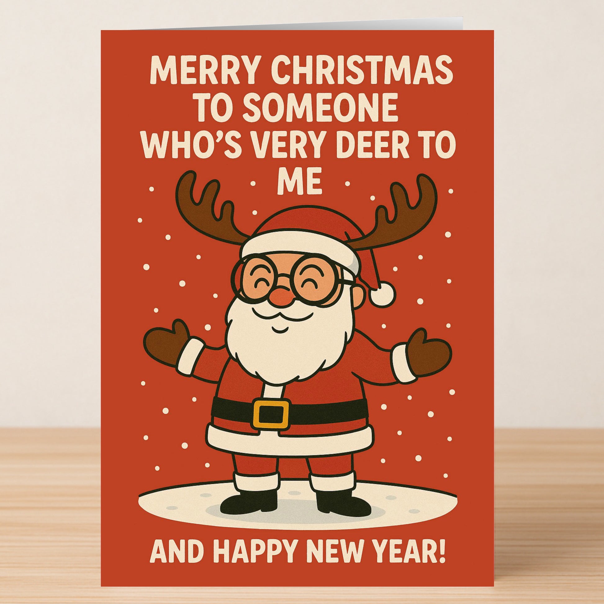 The Very Deer Christmas Card by Twisted Gifts features a cartoon Santa with reindeer antlers and arms open on a red background, with the message: "Merry Christmas to someone who's very deer to me and Happy New Year!.