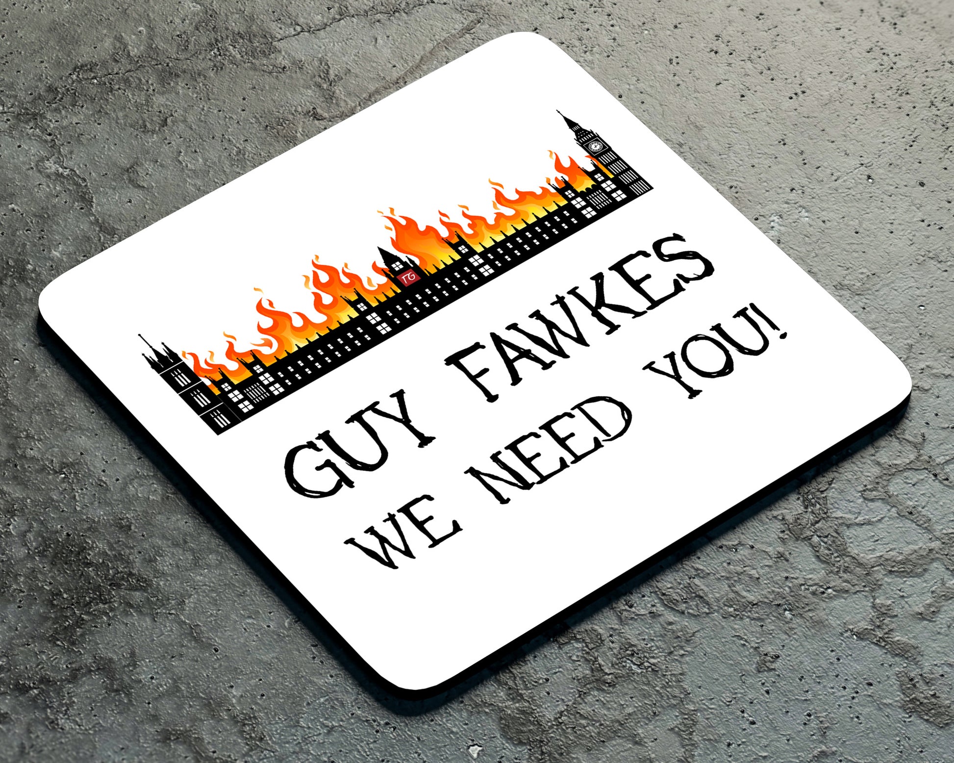 The Guy Fawkes Coaster by Twisted Gifts features the Houses of Parliament on fire and "GUY FAWKES WE NEED YOU!" text on a gray textured surface—ideal for adding unique charm to your home decor.