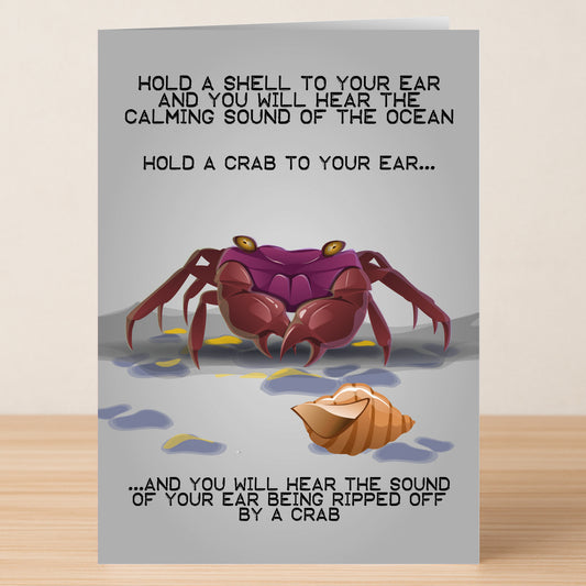 Twisted Gifts' Ocean Funny Greeting Card features a cartoon crab and shell with the message: "Hold a crab to your ear... you'll hear your ear being ripped off!" Great for sharing laughs!.