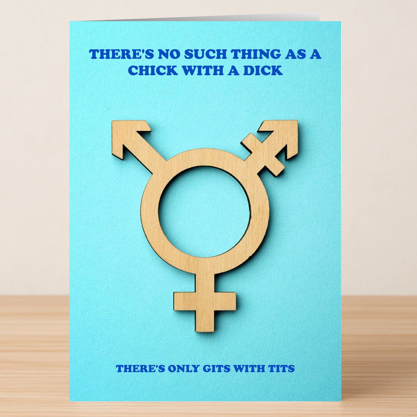The Gits With Tits Rude Greeting Card by Twisted Gifts features a wooden transgender symbol on blue, with the bold statement: "THERE'S NO SUCH THING AS A CHICK WITH A DICK—THERE'S ONLY GITS WITH TITS.
