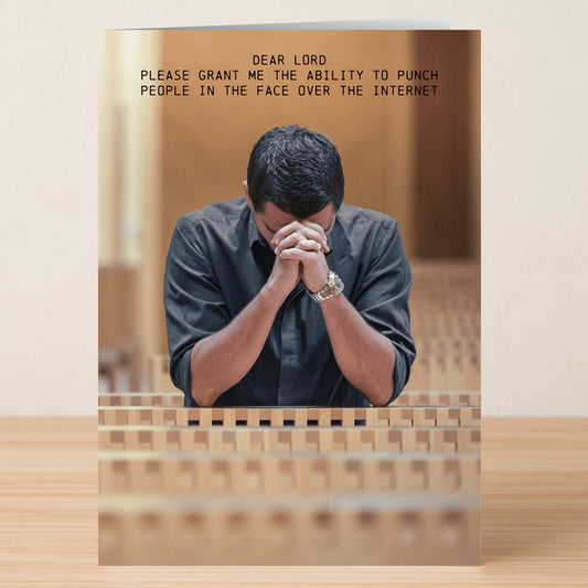 The Twisted Gifts "Dear Lord Rude Greeting Card" features a man praying in a pew with the funny plea, "Dear Lord, please grant me the ability to punch people in the face over the internet." Perfect for those who love cheeky humor.