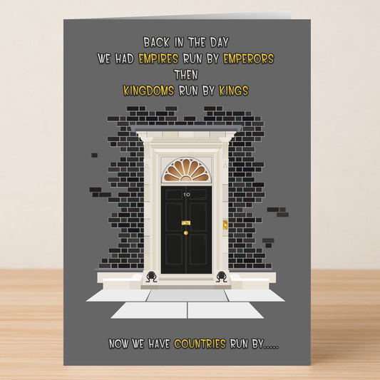 The Emperors Funny Greeting Card by Twisted Gifts blends humor and sharp wit, featuring a black door numbered 10, brick walls, and clever text about empires, kingdoms, and countries run by mysterious forces.