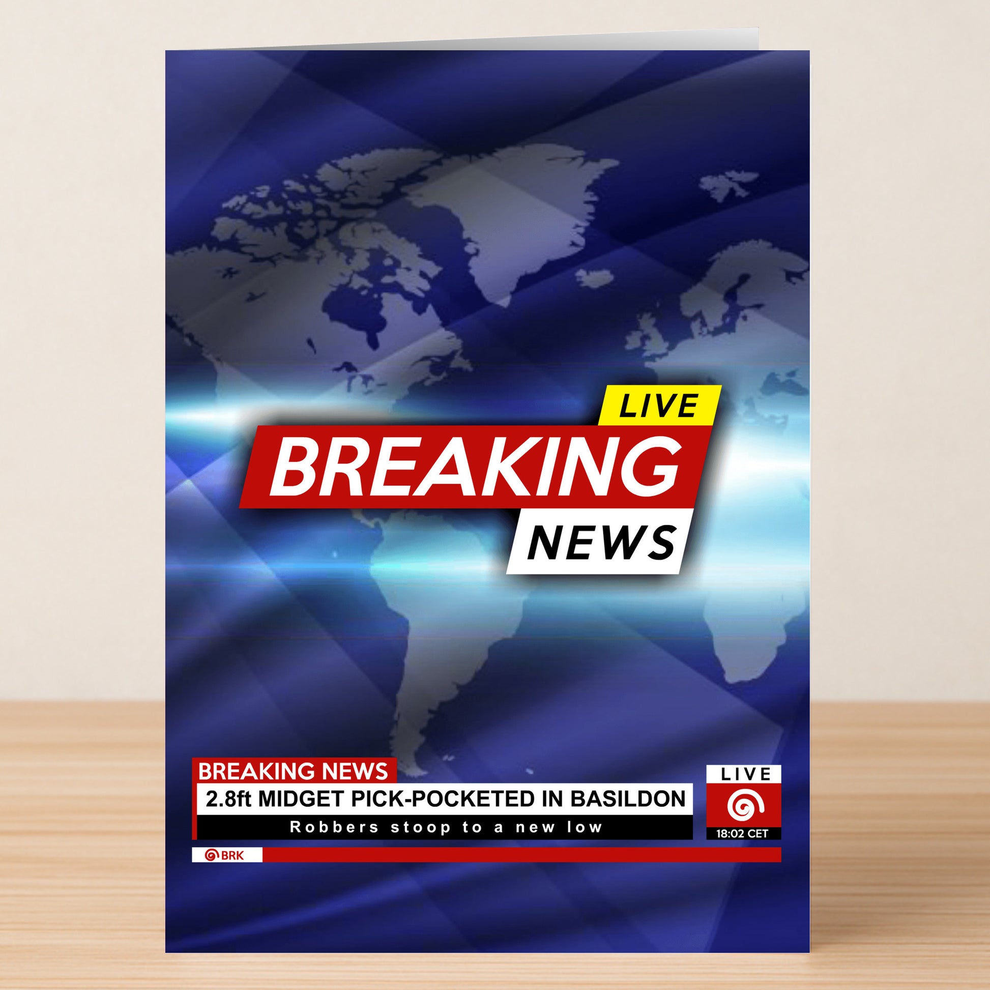 Twisted Gifts’ Pick Pocket Funny Greeting Card features a world map and the headline "2.8ft midget pick-pocketed in Basildon" with the subheading "Robbers stoop to a new low." A hilarious choice for anyone who loves witty, offbeat humor!.