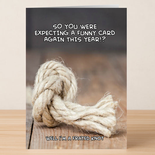 The Frayed Knot Funny Greeting Card by Twisted Gifts features a photo of a frayed knot on wood and the witty text, "SO YOU WERE EXPECTING A FUNNY CARD AGAIN THIS YEAR!? WELL I'M A FRAYED KNOT," crafted from quality materials.