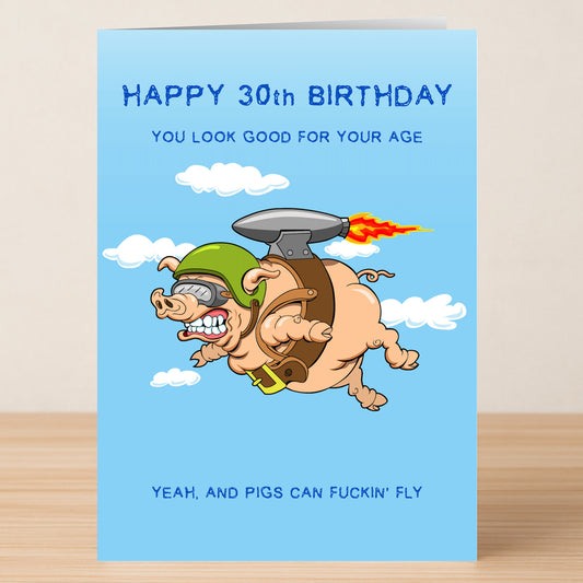 Twisted Gifts' "30 - Pigs Can Fly" card features a jetpack pig cartoon and the text: "Happy 30th Birthday. You look good for your age. Yeah, and pigs can fly." A fun, insulting birthday card for anyone turning 30!.