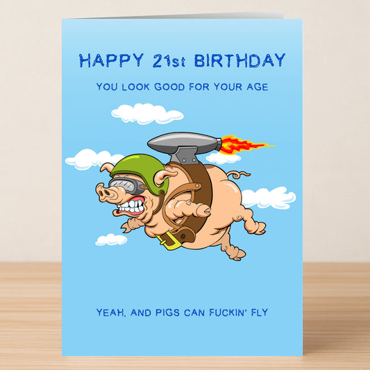 The Twisted Gifts "21 - Pigs Can Fly 21 Insulting Birthday Card" features a cartoon pig in a jetpack and helmet soaring among clouds with the cheeky message: "Happy 21st Birthday, you look good for your age—yeah, and Pigs Can Fly.