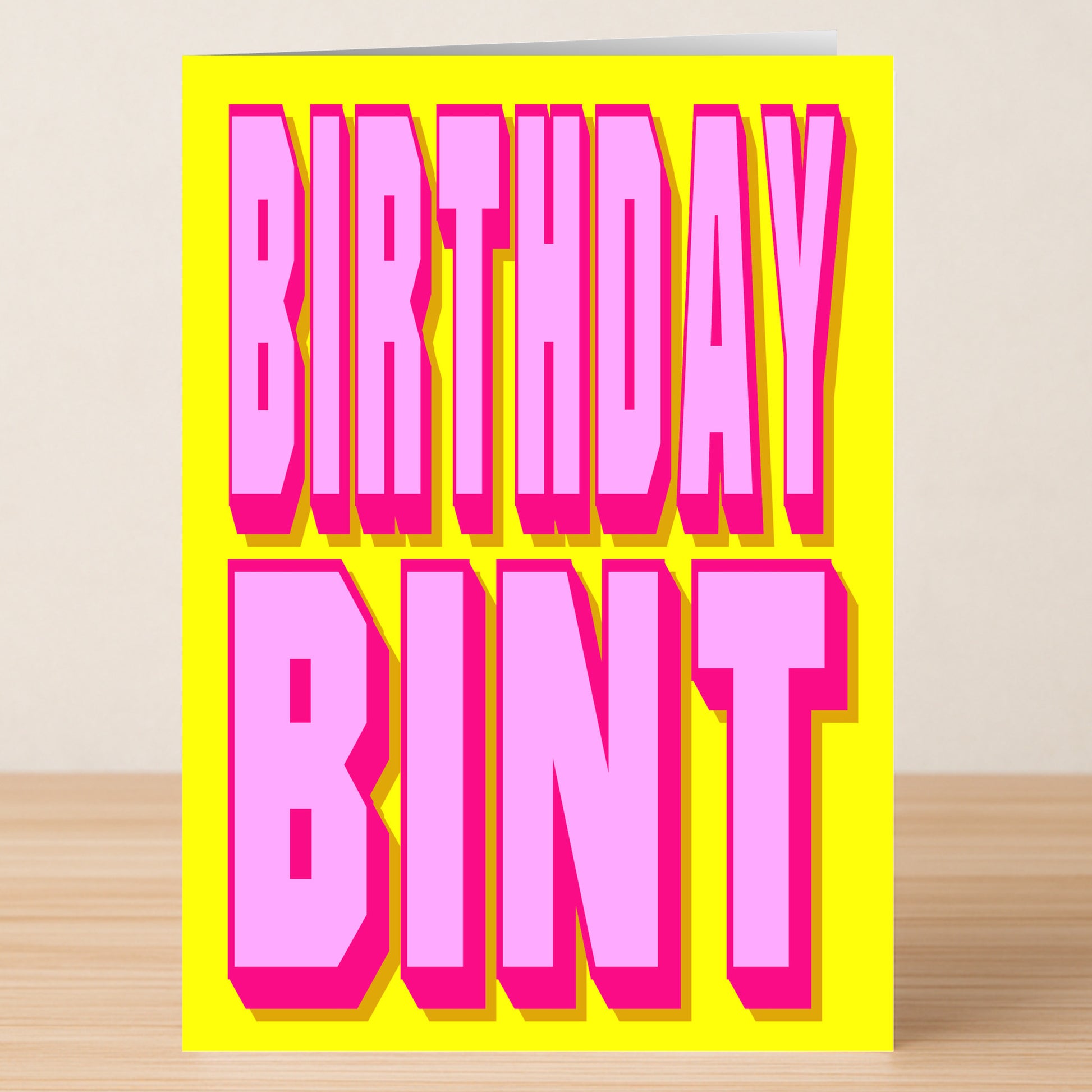 The Bint Insulting Birthday Card by Twisted Gifts features witty humor and bold pink 3D "BIRTHDAY BINT" text on a bright yellow background, making it a striking and fun choice for any birthday.