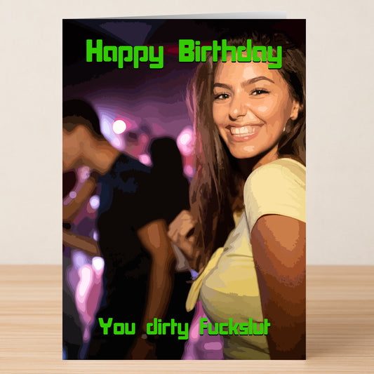 A woman smiles at a neon-lit party. Green text reads "Happy Birthday" and "You dirty fuckslut," showcasing Twisted Gifts' Fuck Slut Insulting Birthday Card—a bold, no-nonsense, and unique birthday message.