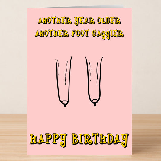 The Another Foot Insulting Birthday Card by Twisted Gifts is a pink, edgy card with cartoon sagging balloons and the cheeky message: "Another year older, another foot saggier. Happy Birthday.