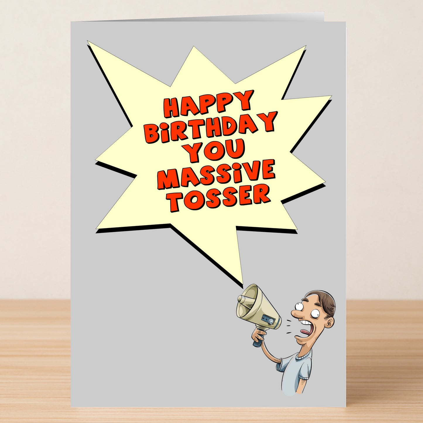 The Massive Tosser Offensive Birthday Card by Twisted Gifts features a cartoon with a megaphone and the message "Happy Birthday You Massive Tosser." Ideal for adults with a cheeky sense of humor.