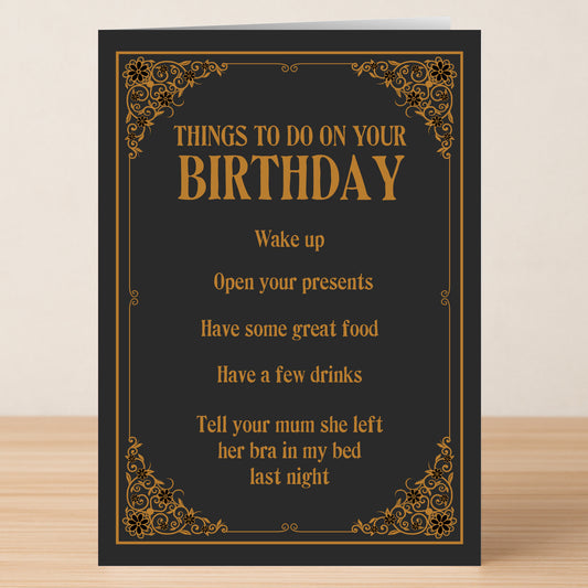 The Tell Your Mum Rude Birthday Card by Twisted Gifts features black and gold design with cheeky humor and funny tasks like waking up, opening presents, eating, drinking, and a playful joke about someone's mum's bra.