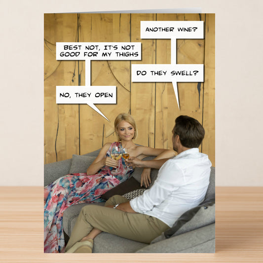 A woman in a floral dress and a man in a white shirt sit on a couch, clinking wine glasses with funny speech bubbles about wine and thighs—Twisted Gifts’ Thighs Funny Birthday Card is perfect for anyone with a quirky sense of humor.