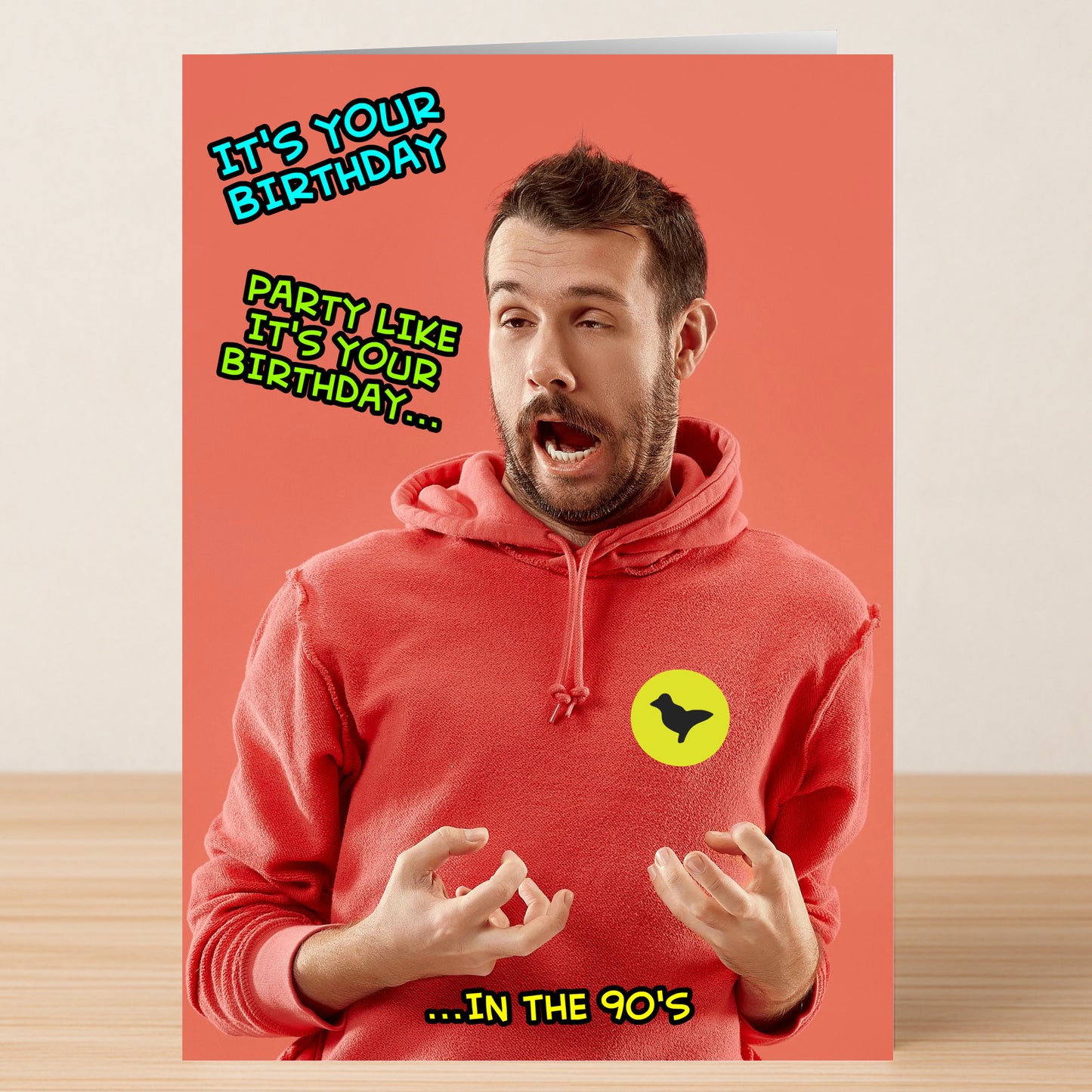 A man in a red hoodie makes a playful face with half-closed eyes. Text: "It's your birthday. Party like it's your birthday... in the 90's." Dove Party, Funny Birthday Card by Twisted Gifts—perfect for anyone who loves a retro vibe!.