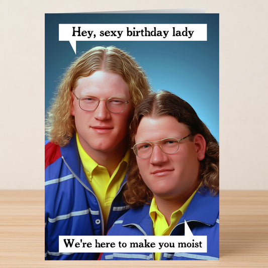 Send funny birthday wishes with the "Hey Lady, Funny Birthday Card" by Twisted Gifts—featuring two long-haired, bespectacled men and cheeky text: "Hey, sexy birthday lady. We're here to make you moist.