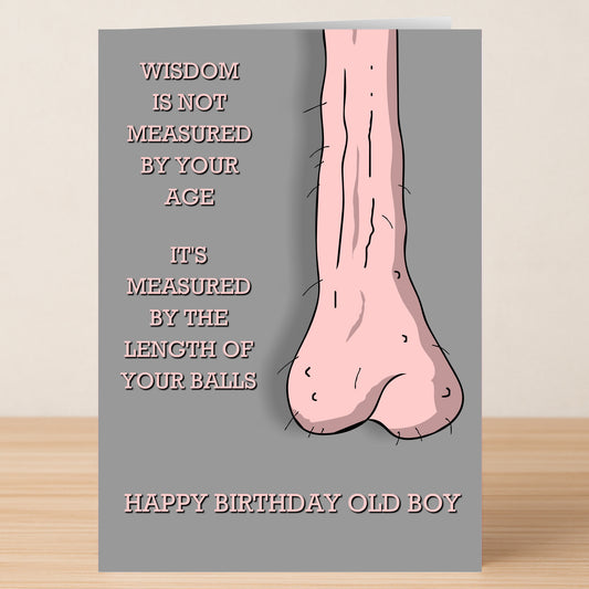 The Wisdom, Rude Birthday Card by Twisted Gifts features long, sagging testicles with the message: "Wisdom is not measured by your age, it's measured by the length of your balls. Happy birthday old boy." Ideal for fans of cheeky humor.