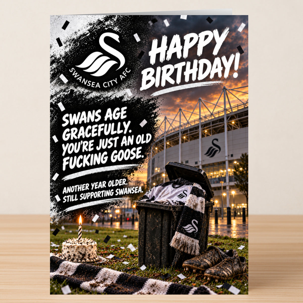Swansea – Funny Birthday Card featuring a stadium and cake background, with text reading: “Happy Birthday! Swans age gracefully. You’re just an old fucking goose. Another year older. Still supporting Swansea.”