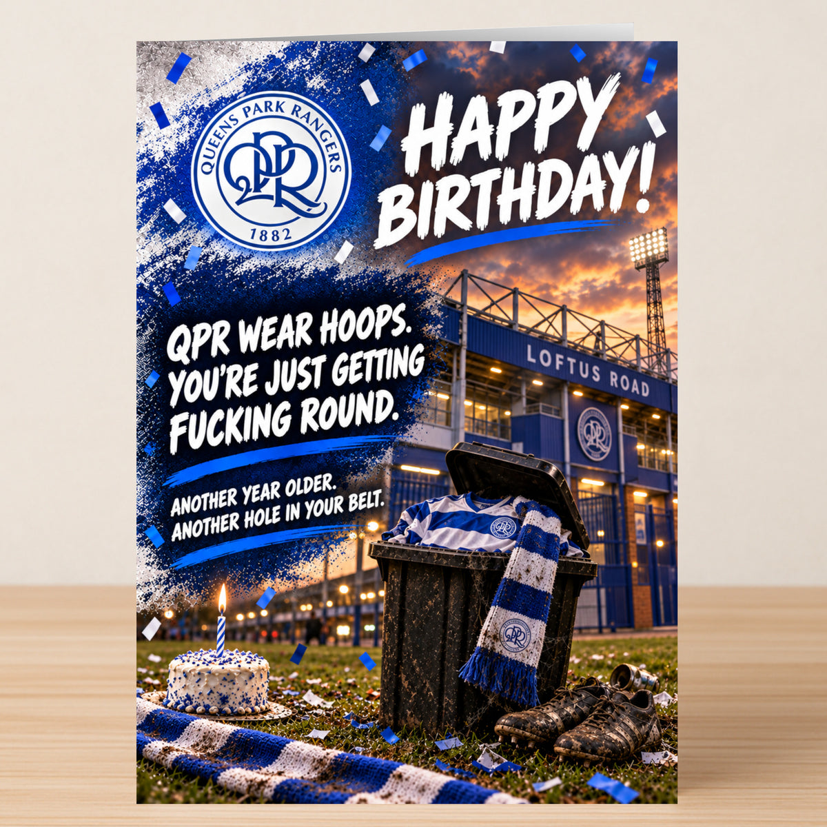 A Queens Park Rangers – Funny Birthday Card featuring the QPR crest and stadium, with the text: “Happy Birthday! QPR wear hoops. You’re just getting fucking round. Another year older. Another hole in your belt.”