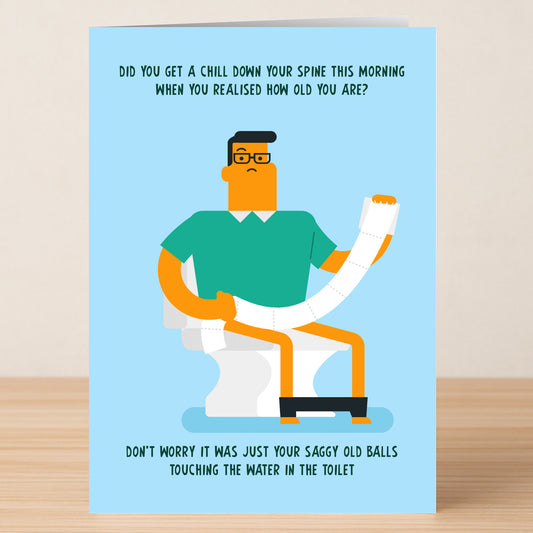 Twisted Gifts' Toilet Insulting Birthday Card features a witty illustration of a man with glasses on a toilet, holding a long roll of toilet paper, with playful humor about aging above and below the image.