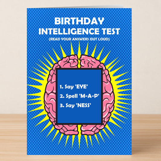Give a clever birthday surprise with Twisted Gifts’ Intelligence Insulting Birthday Card—featuring a cartoon brain on blue and the “Birthday Intelligence Test” challenge: "1. Say 'EYE,' 2. Spell 'M-A-P,' 3. Say 'NESS.'.
