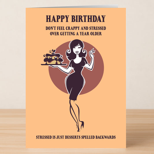 The Stressed Funny Birthday Card from Twisted Gifts features a woman with a cake and witty text about birthdays, cleverly playing on “stressed” spelled backward as “desserts.”.