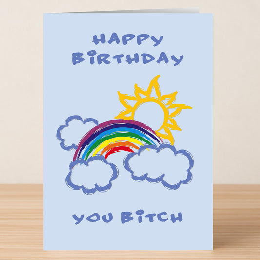 The Sunny Bitch Insulting Birthday Card by Twisted Gifts features “Happy Birthday You Bitch” with a sun, rainbow, and clouds on light blue—perfect for friends who love playful sarcasm.