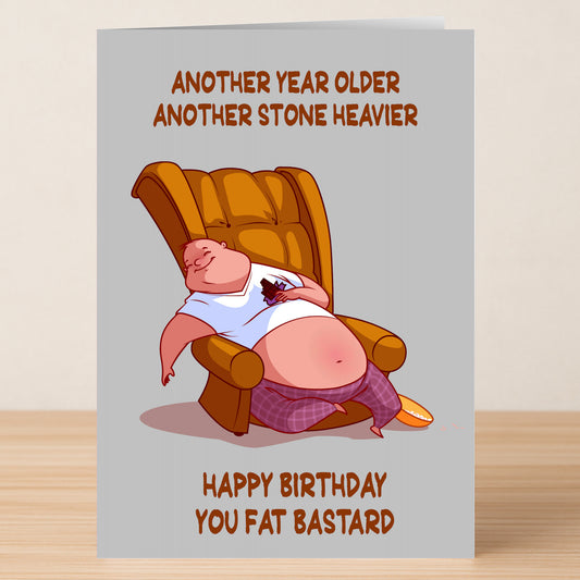 The Fat Bastard Insulting Birthday Card by Twisted Gifts features a funny cartoon of an overweight man lounging with the message "Another year older, another stone heavier. Happy Birthday you fat bastard." Ideal for a cheeky laugh!.