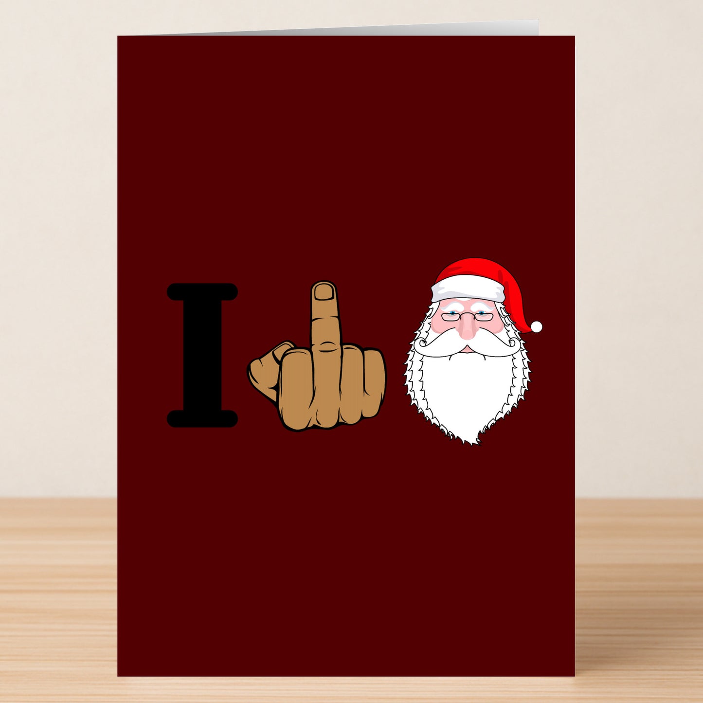 The I Love Xmas Funny Christmas Card by Twisted Gifts features a red background with the letter "I," a raised middle finger, Santa's face, and delivers a cheeky twist on holiday cheer.