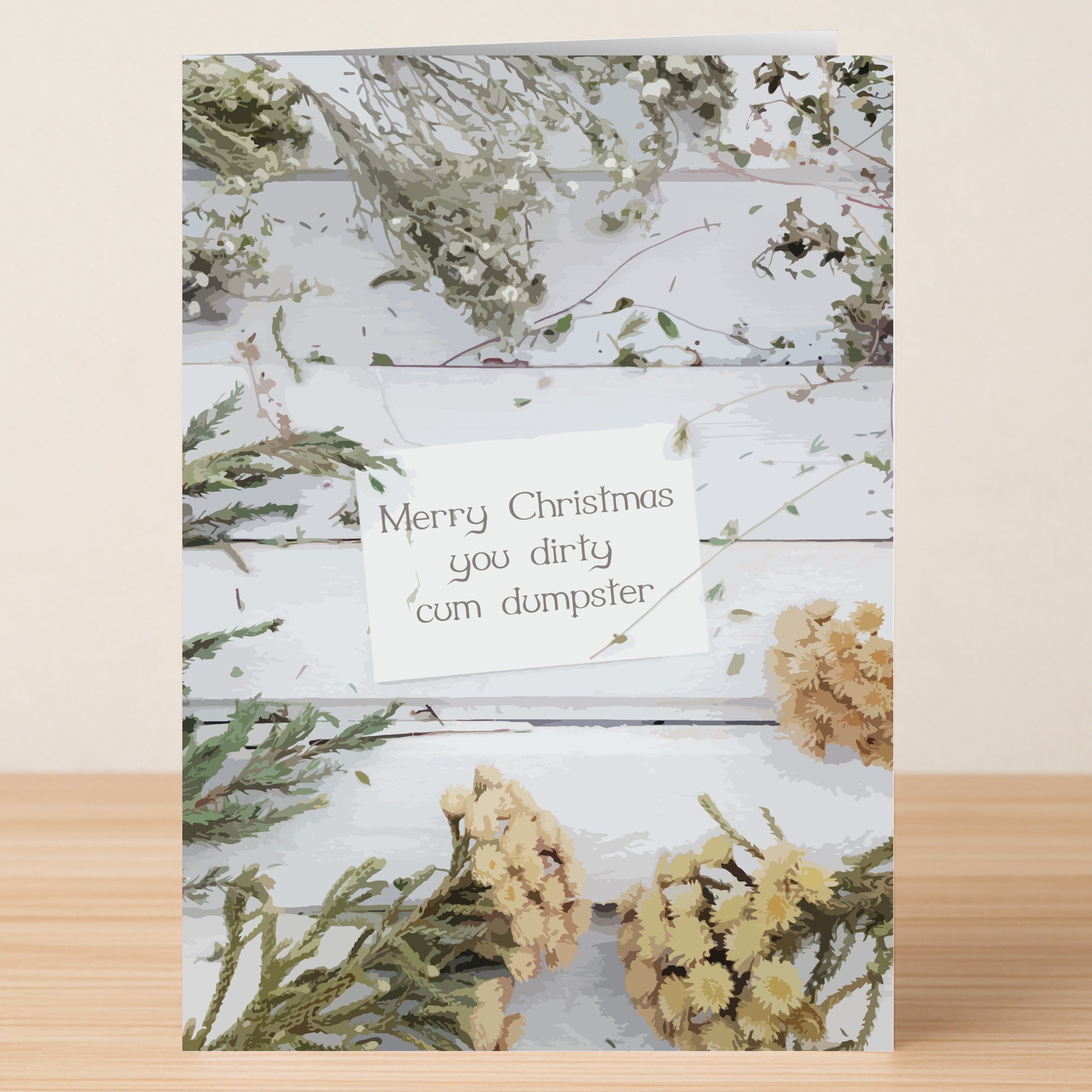 The Cum Dumpster Rude Christmas Card by Twisted Gifts features dried flowers on wood and a cheeky "Merry Christmas you dirty cum dumpster" note—ideal for sharing naughty holiday humor.