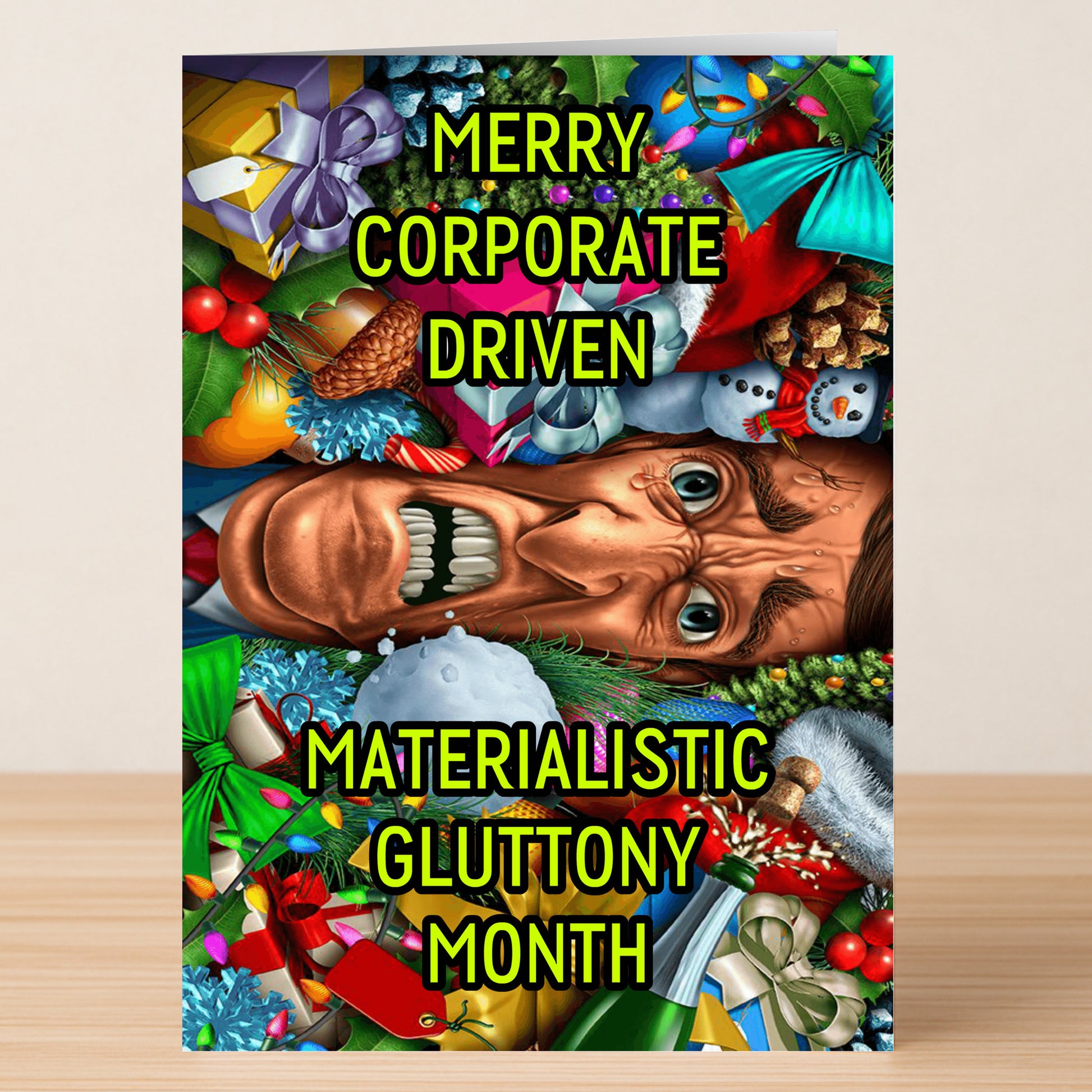 The Corporate Funny Christmas Card from Twisted Gifts features a colorful holiday collage with an angry face and the text "Merry Corporate Driven Materialistic Gluttony Month"—a hilarious twist for your holiday greetings.
