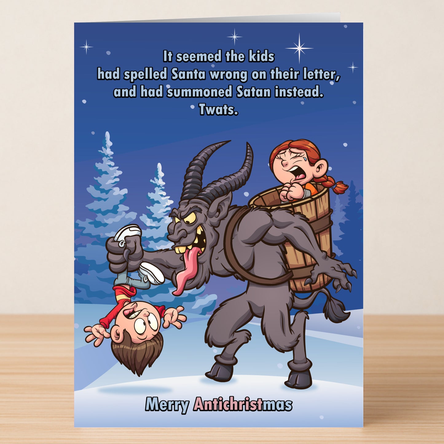 The Antichristmas Funny Christmas Card by Twisted Gifts features a cartoon Krampus holding socks and a boy, with a girl in his basket, joking about kids summoning Satan instead of Santa. "Merry Antichristmas" adds a twisted touch to your holiday greetings.