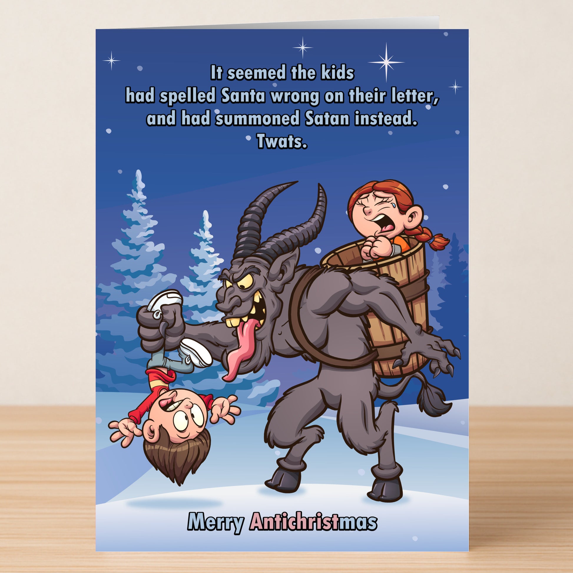 The Antichristmas Funny Christmas Card by Twisted Gifts features a cartoon Krampus holding socks and a boy, with a girl in his basket, joking about kids summoning Satan instead of Santa. "Merry Antichristmas" adds a twisted touch to your holiday greetings.