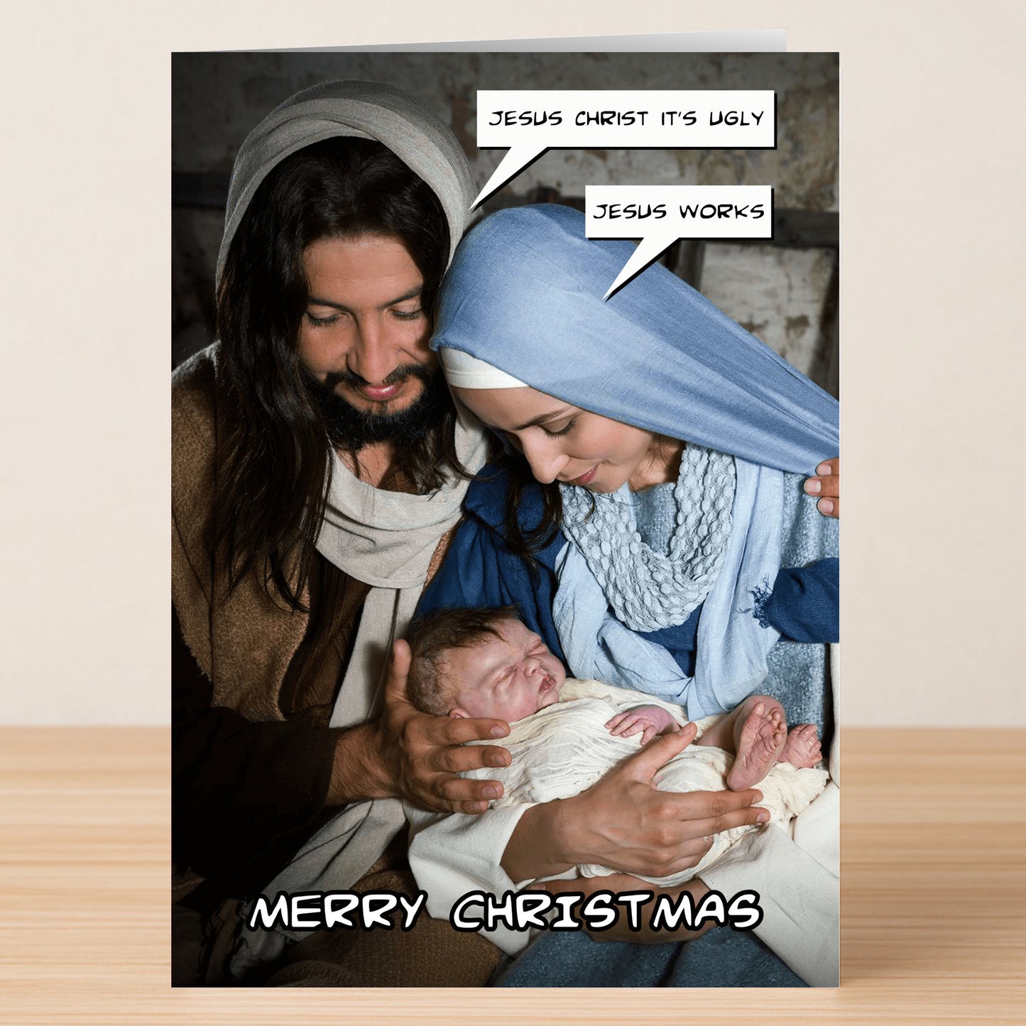 The Jesus Funny Christmas Card by Twisted Gifts shows Mary and Joseph with humorous speech bubbles as they look at baby Jesus, plus "Merry Christmas" on the bottom—a unique, funny choice for holiday greetings.