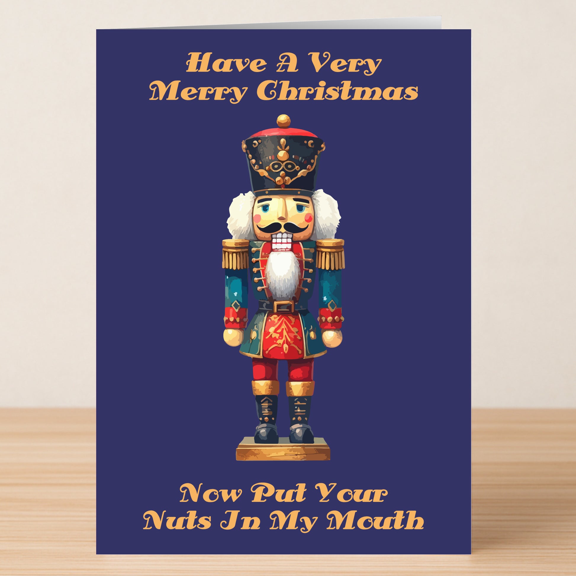 The In My Mouth Rude Christmas Card by Twisted Gifts features a nutcracker and the playful message, "Have A Very Merry Christmas. Now Put Your Nuts In My Mouth." Ideal for sending cheeky holiday greetings with a mischievous twist!.