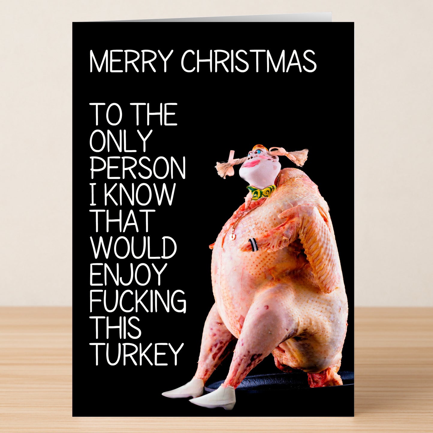 The Only Person Rude Christmas Card by Twisted Gifts features a funny raw turkey with human traits and reads: "Merry Christmas. To the only person I know that would enjoy fucking this turkey.