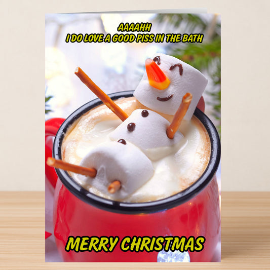 The "In The Bath" Funny Christmas Card by Twisted Gifts features a marshmallow snowman relaxing in hot chocolate with the cheeky text "AAAAHH I DO LOVE A GOOD PISS IN THE BATH" and "Merry Christmas." Guaranteed to get laughs!.