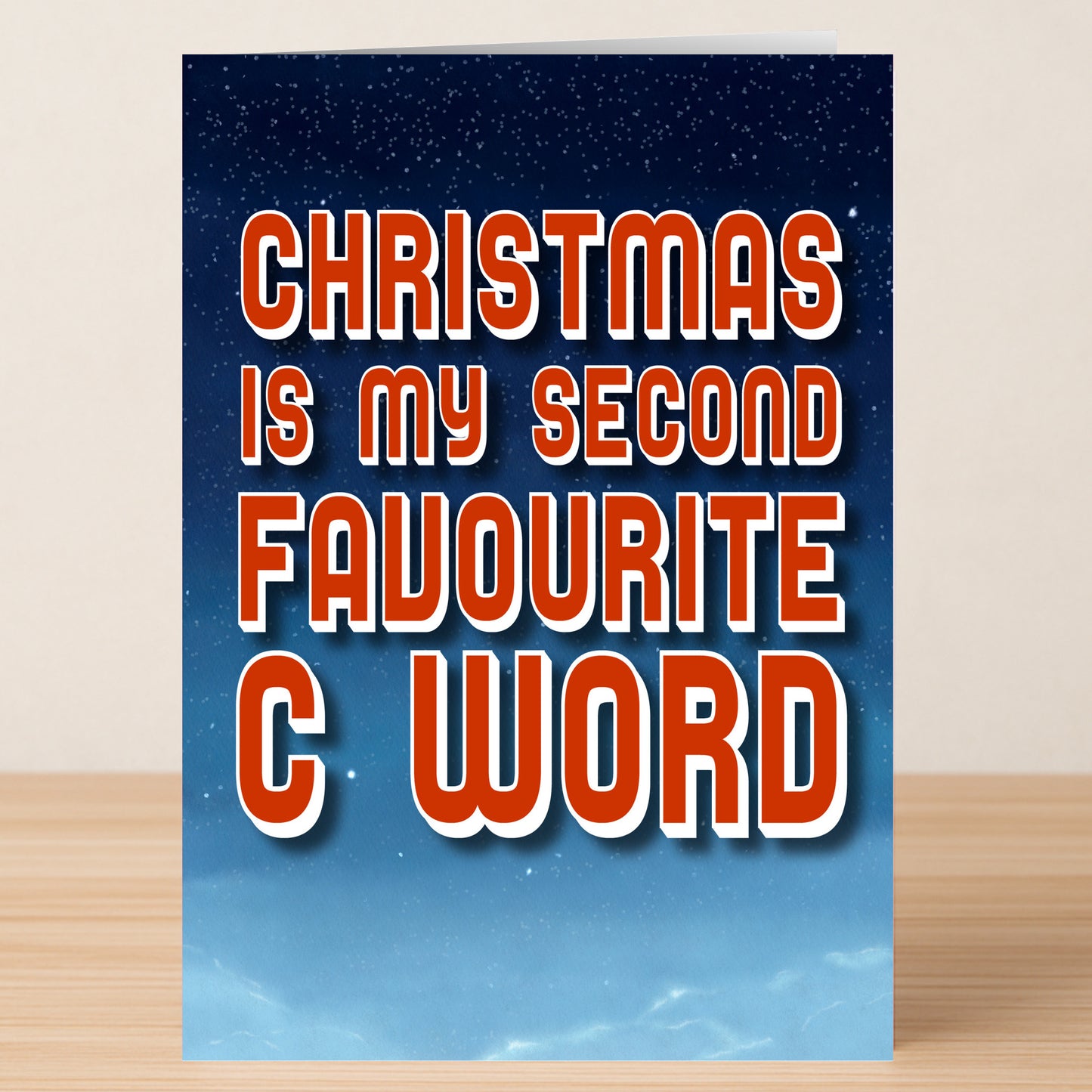 The Favourite Word Christmas Card by Twisted Gifts features bold red and white text, "Christmas is my second favourite C word," on a starry night sky—perfect for anyone who enjoys cheeky holiday humour.