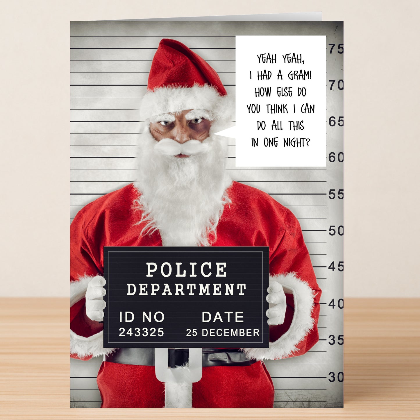 The One Night Christmas Card by Twisted Gifts features Santa in front of a height chart with a police sign and a speech bubble joking about delivering gifts in one night—an ideal cheeky holiday card.