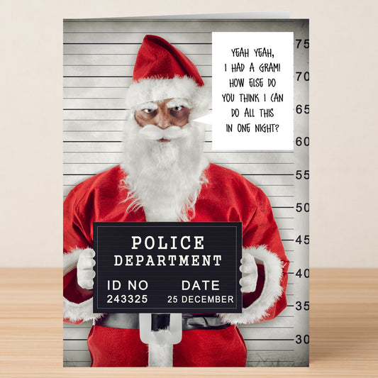 The One Night Christmas Card by Twisted Gifts features Santa in front of a height chart with a police sign and a speech bubble joking about delivering gifts in one night—an ideal cheeky holiday card.