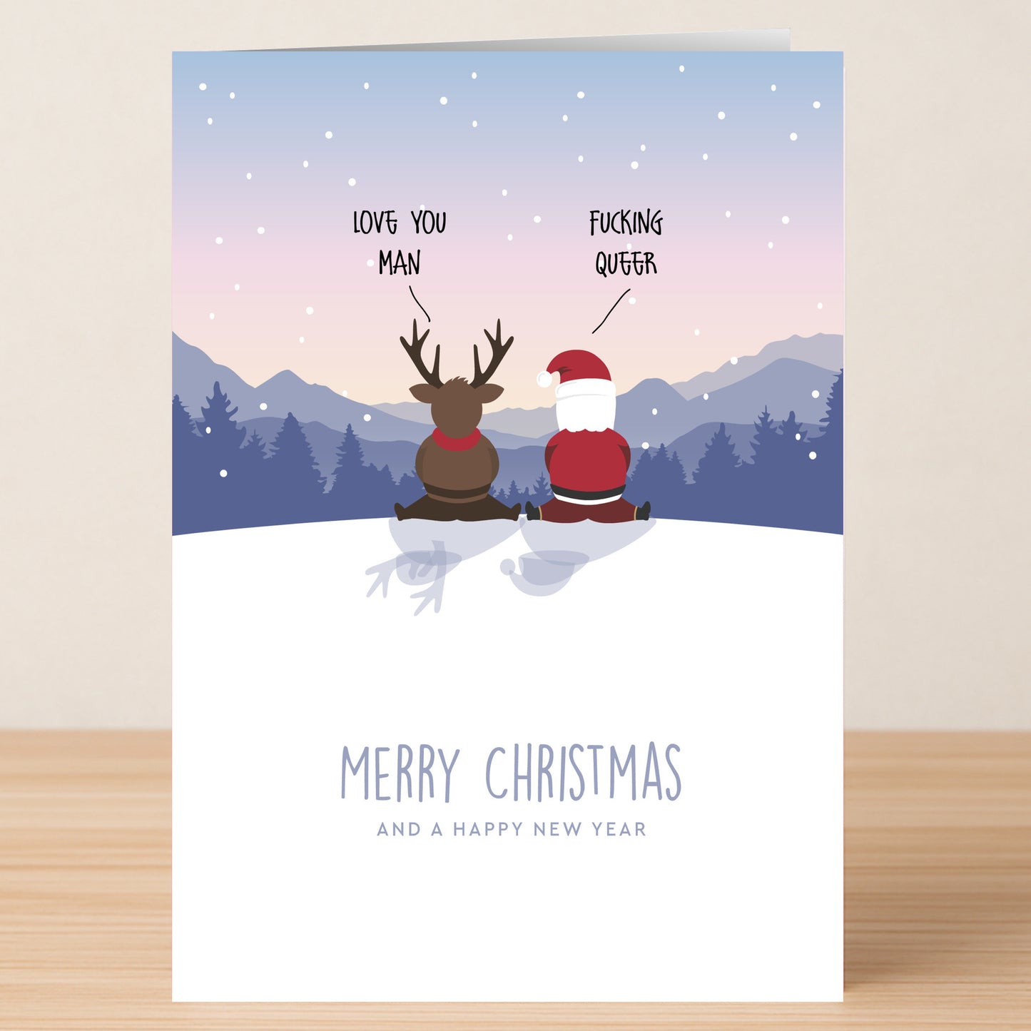 Twisted Gifts’ Queer Christmas Card shows a reindeer and Santa on snowy ground, mountains at sunset behind them, with the phrases “LOVE YOU MAN,” “FUCKING QUEER,” and “MERRY CHRISTMAS AND A HAPPY NEW YEAR.”.