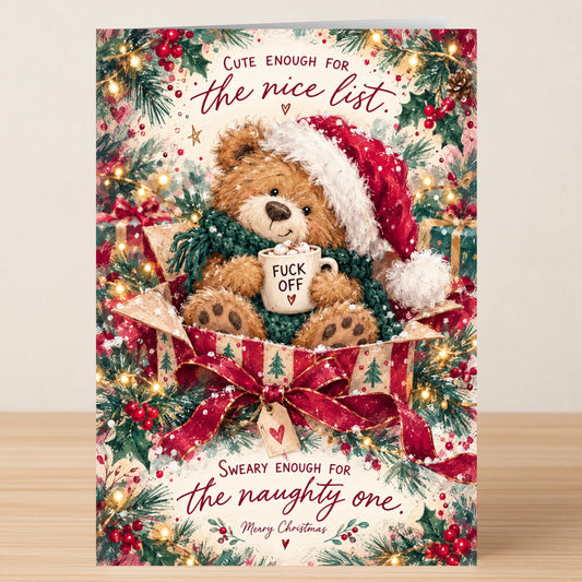 Cute Enough - Funny Christmas Card features a teddy bear in a Santa hat inside a gift box, holding a mug that says “FUCK OFF” with text: “Cute enough for the nice list. Sweary enough for the naughty one.”