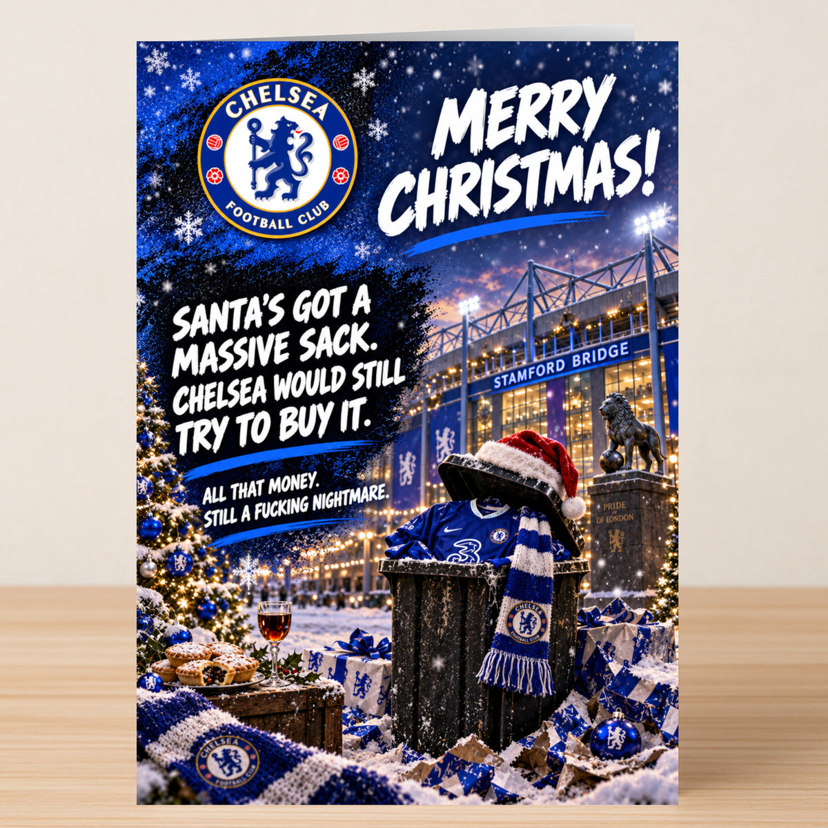 A Chelsea – Funny Christmas Card featuring the Chelsea FC logo and a trash can full of merchandise, with the text: “Merry Christmas! Santa’s got a massive sack. Chelsea would still try to buy it.”