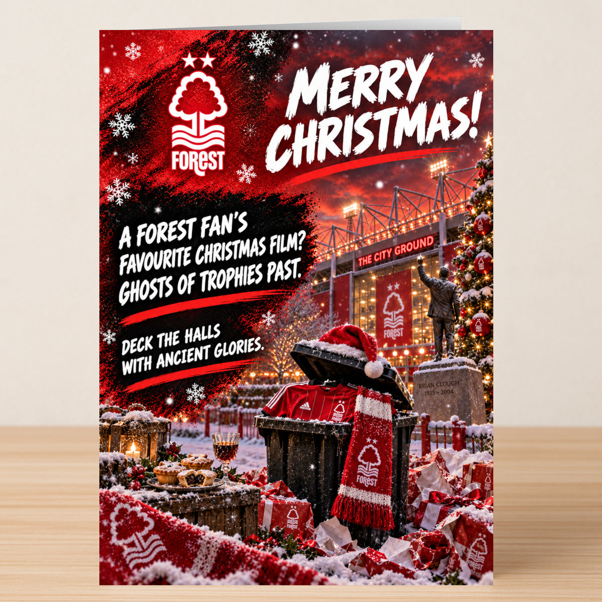Nottingham Forest – Funny Christmas Card featuring The City Ground and a Brian Clough statue, with the text “Merry Christmas! A Forest fan’s favourite Christmas film? Ghosts of trophies past.”