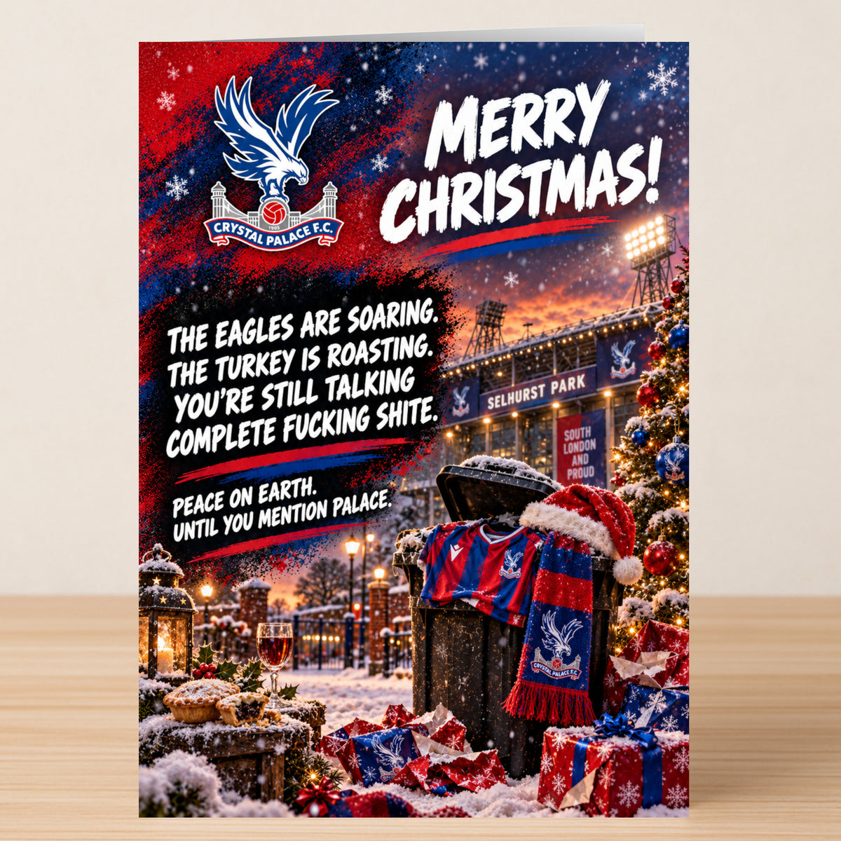 A Crystal Palace FC – Funny Christmas Card featuring the team logo and a festive stadium scene, captioned: “Merry Christmas! The eagles are soaring. You’re still talking complete fucking shite.”