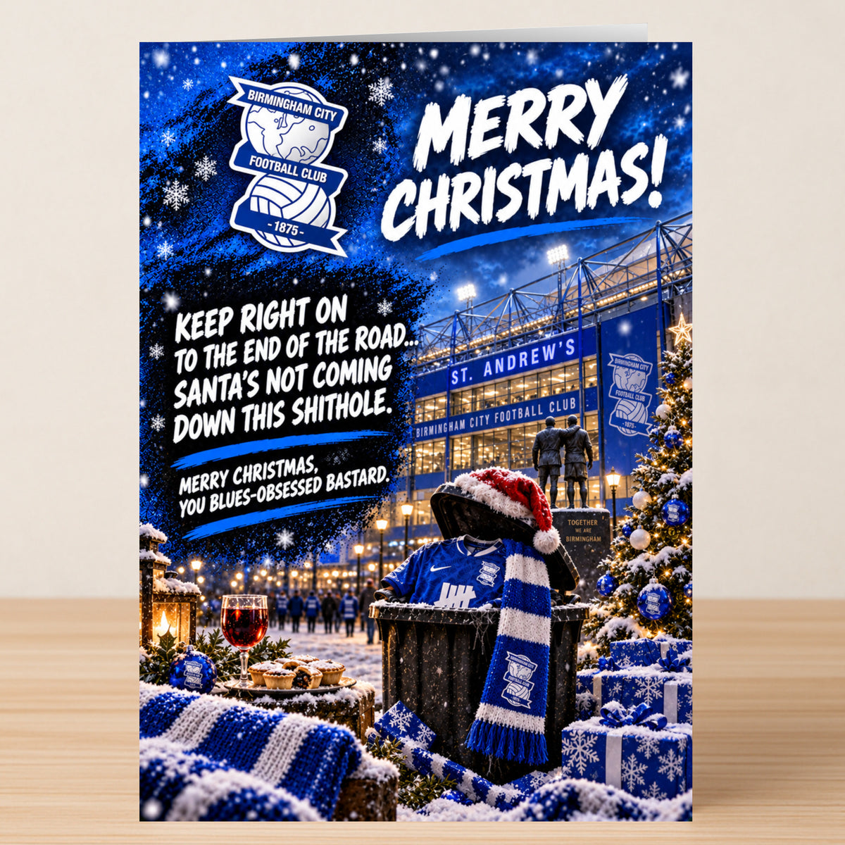 Birmingham City – Funny Christmas Card featuring St. Andrew’s stadium next to a trash can wearing a Santa hat and team scarf, with the text: “Merry Christmas! Keep right on to the end of the road... Santa’s not coming down this shithole.”