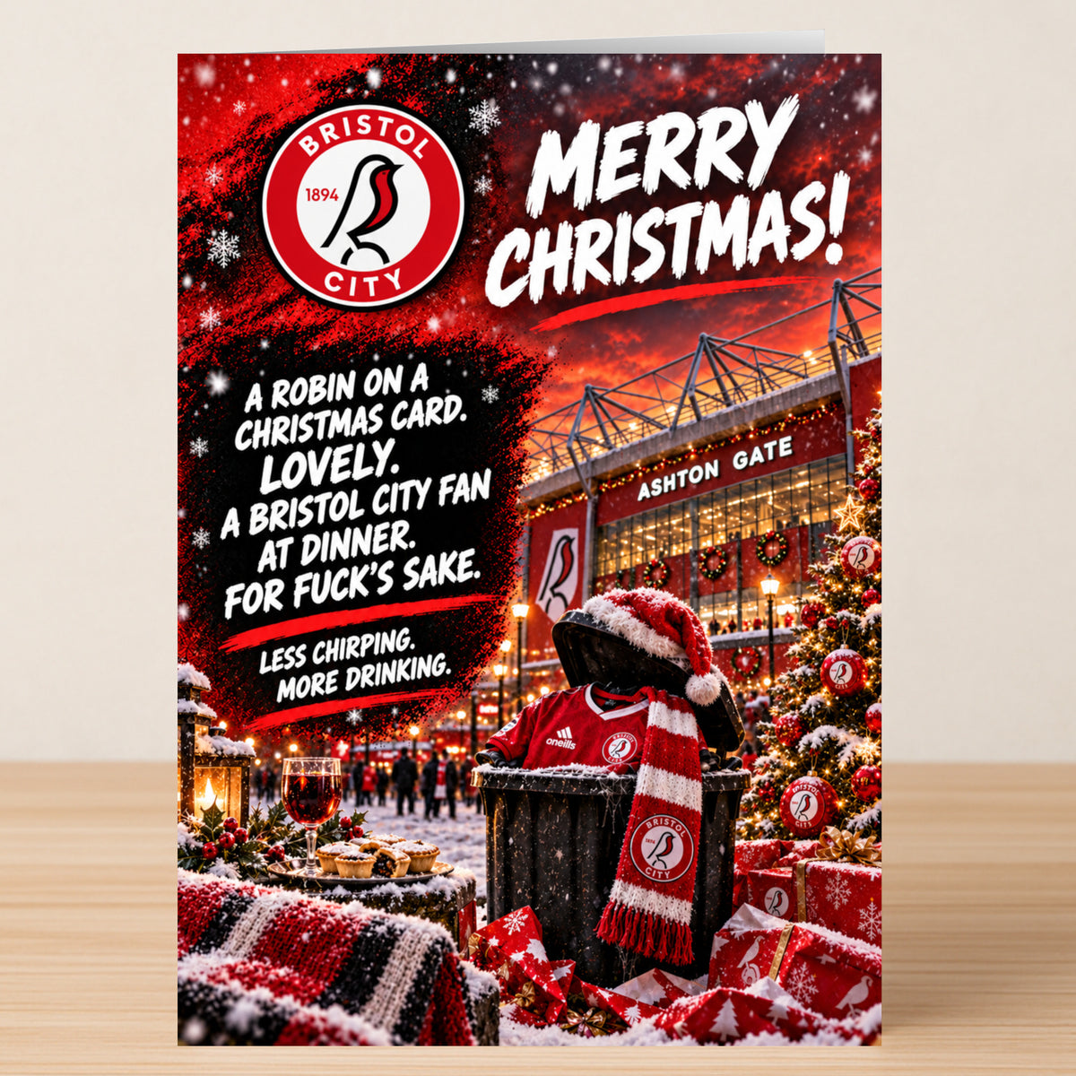 A Bristol City – Funny Christmas Card featuring the team logo, stadium, and a robin illustration with the text: “A robin on a Christmas card. Lovely. A Bristol City fan at dinner. For fuck’s sake. Less chirping.”
